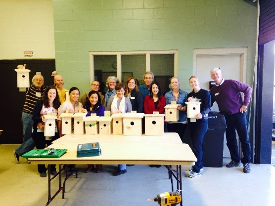 Valencia College faculty & students pose with animal boxes.