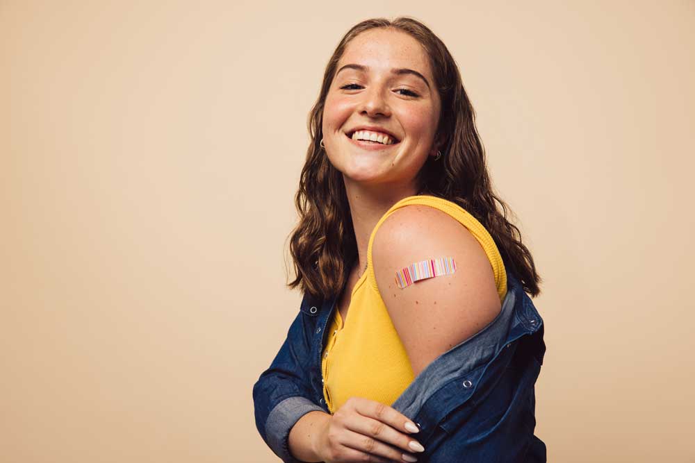 female student with band aid on arm