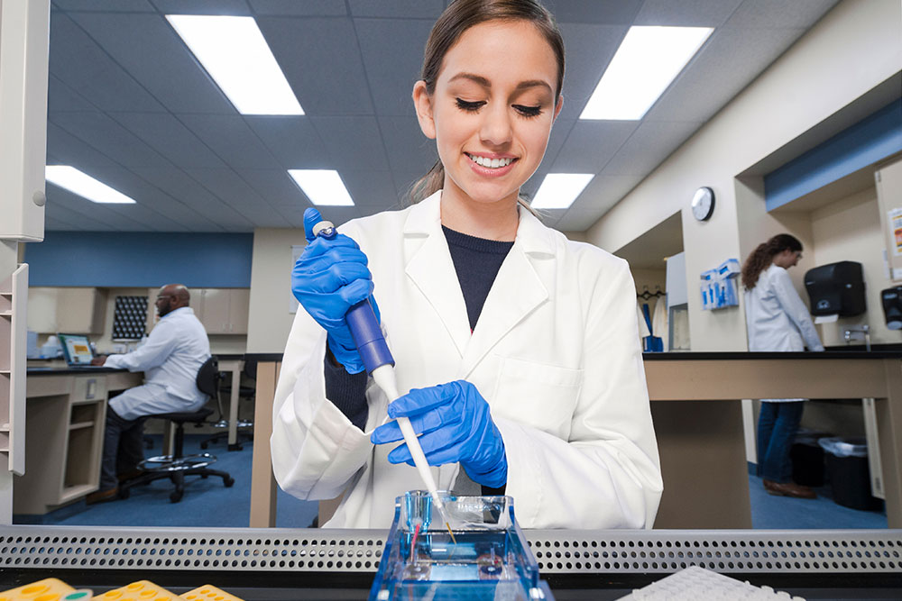 Biotechnology student using pipette Biotechnology Laboratory Sciences Associate in Science (A.S.) degree