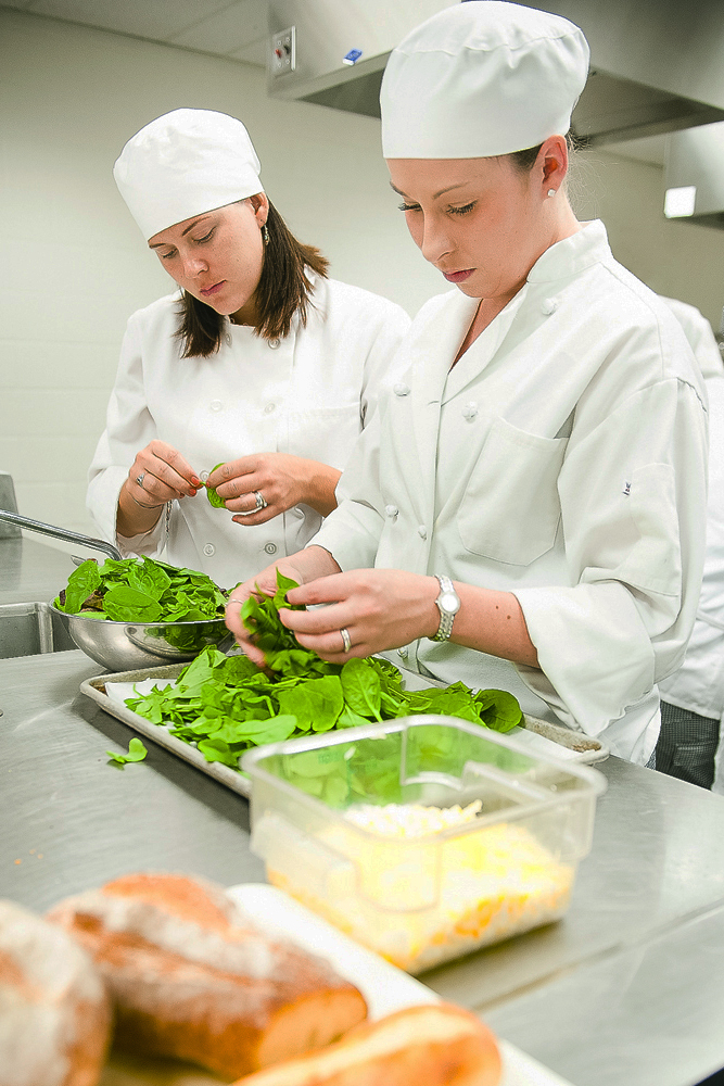 Preparing food in Ken Bourgoin's Culinary class - Restaurant and Food Service Management