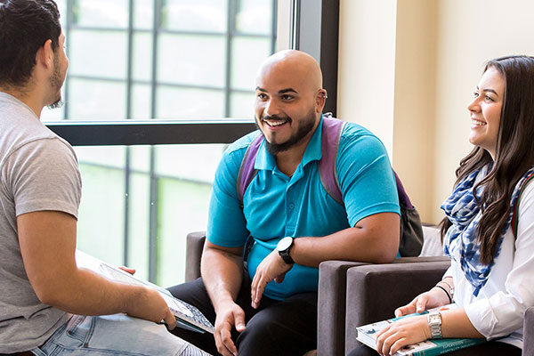 Return to College students meeting in library